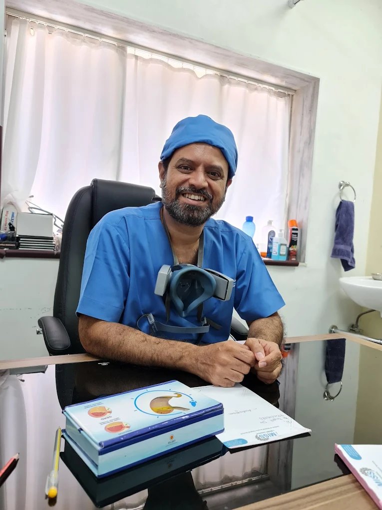 Dr. Maqsood Ali Khan, ENT, Head-Neck and Skull-Base Surgeon, at his consulting desk in Mumbai